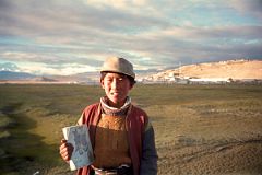 18 A Local Boy Carries His Books On His Way To School In Tingri